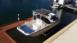 17ft Whaler on mechanical boatlifter located in the inside of the jetty