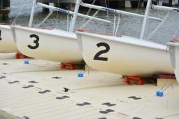 Multiple side by side EZ BoatPorts housing small sailing skiffs